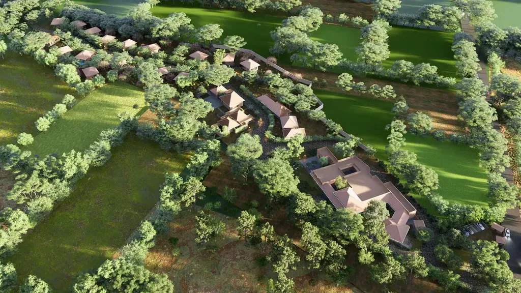 Flying low over tiled roofs and gardens of the cottage cluster